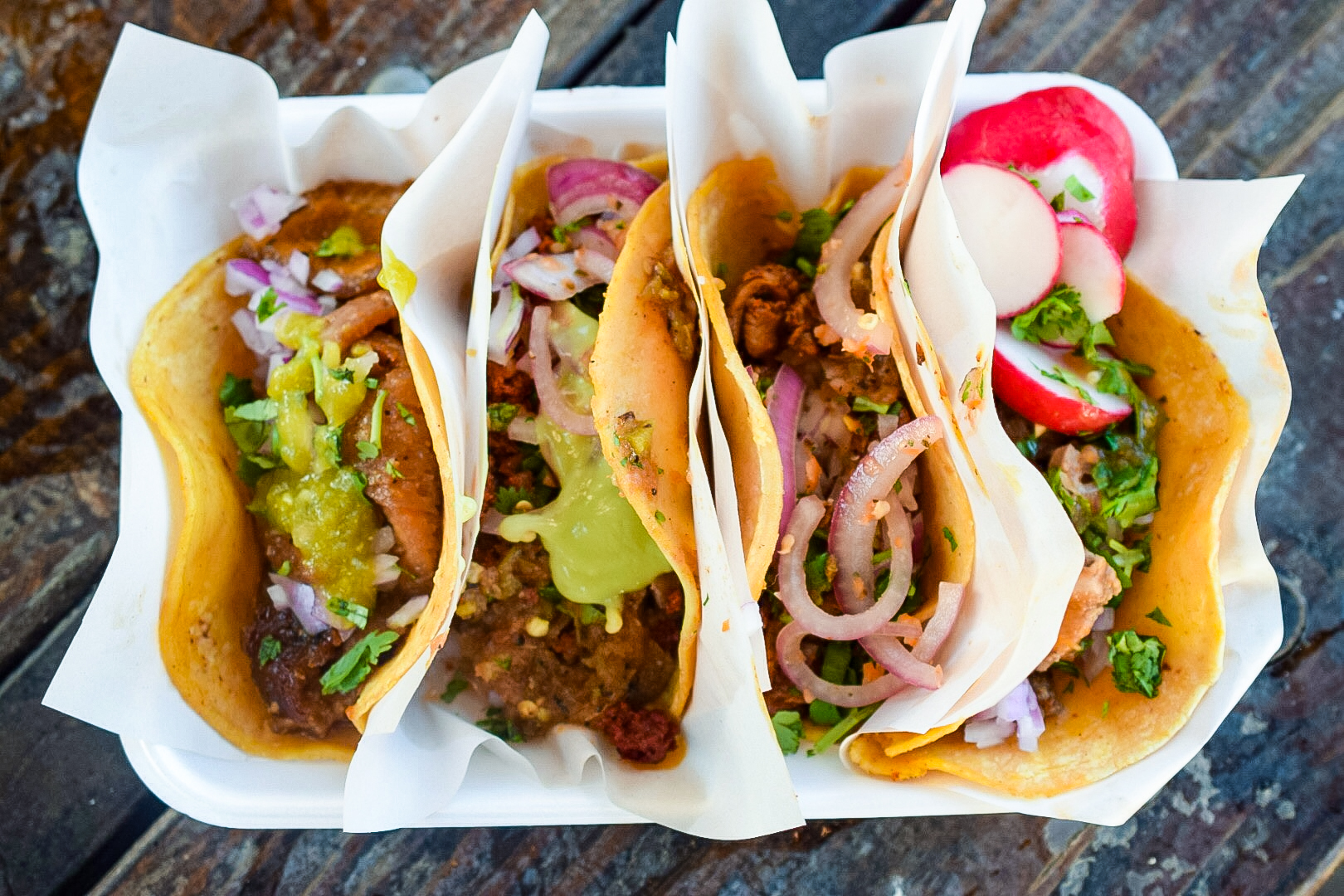 Cabeza, birria, al pastor and machaca tacos from BXB Taqueria